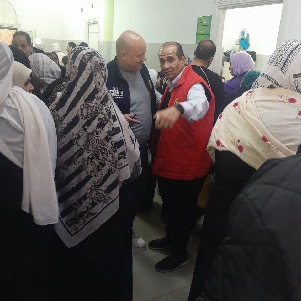 Rotary volunteers assisting families inside the El Amrawy medical clinic